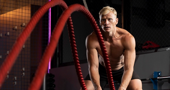 Gym member training in modern facility for fitness tips blog