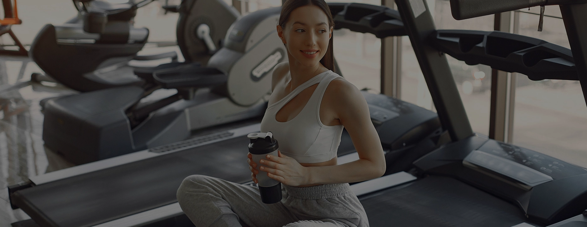 Motivated gym member using modern gym equipment