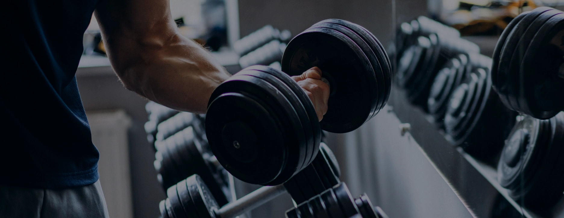 Motivated gym member using modern gym equipment